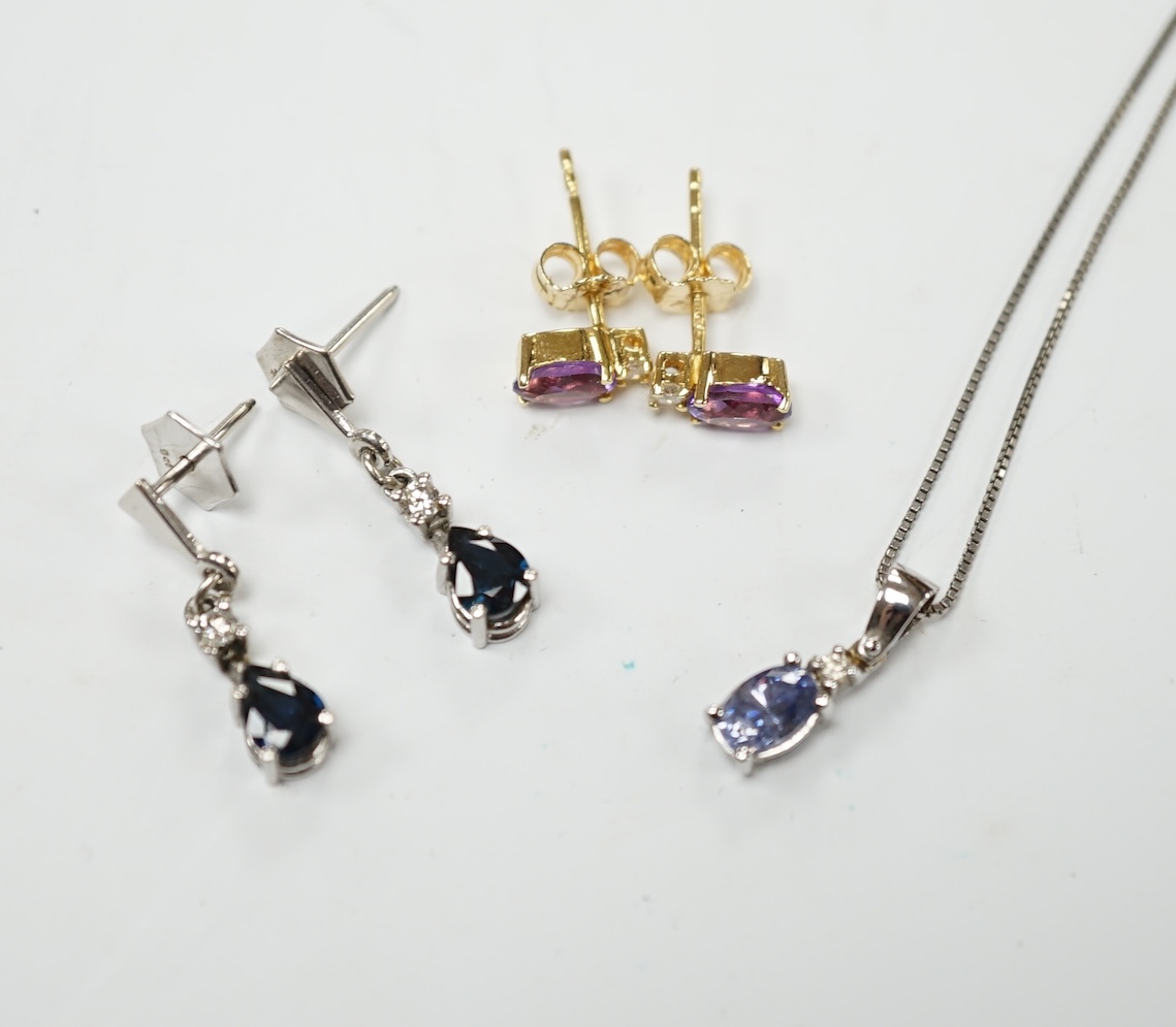 A modern 18ct white gold sapphire and diamond set drop pendant, 13mm, on a 925 chain, together with a modern pair of 750 yellow metal, amethyst and diamond set ear studs and a pair of 9ct sapphire and diamond set ear stu